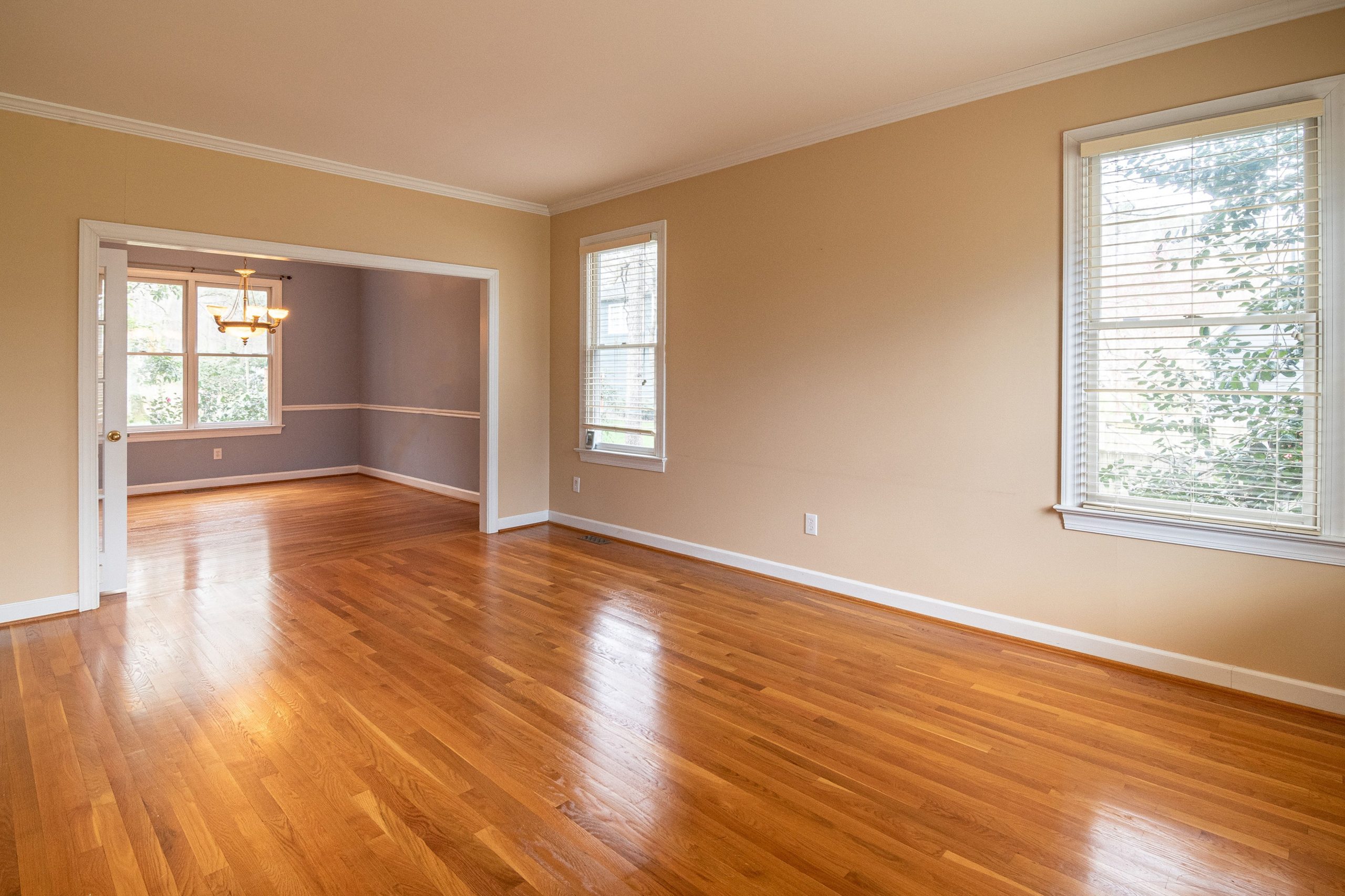Hardwood floor refinishing contractor restoring wood flooring
